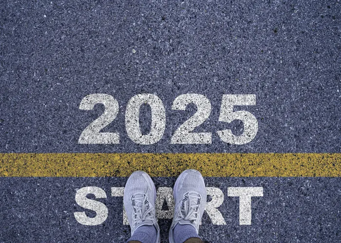 Runner standing at the starting point with 2025 year for starting in new year 2025 to achieve business planing and success concept.
